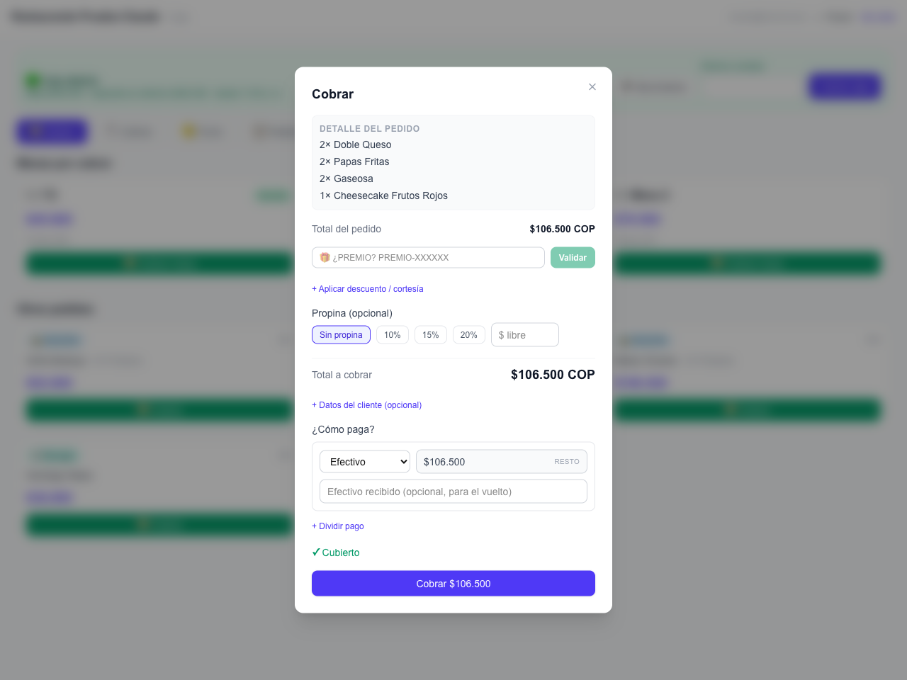 caja: panel de cobro con pago dividido, propina y descuento (/caja)